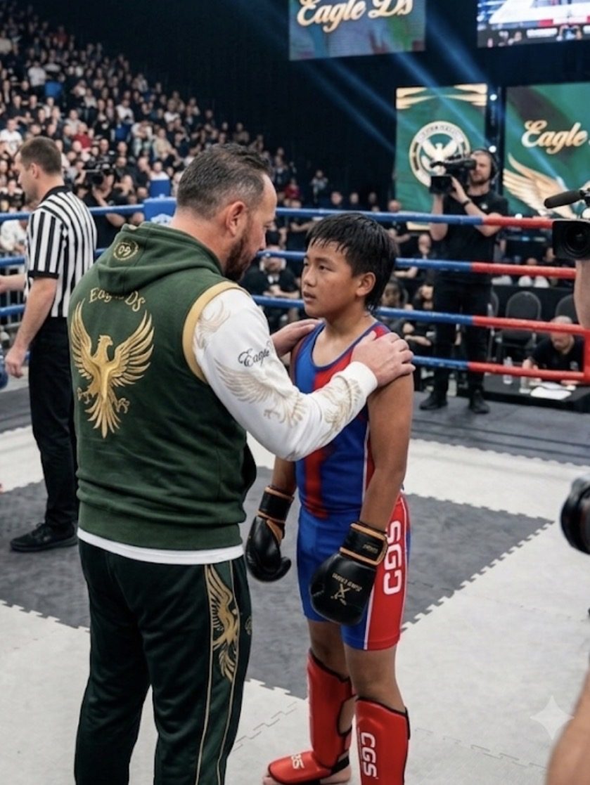 Coach speaking with a young competitor before a bout